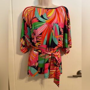 Trina Turk open shoulder top with bright colors and tie at waist. Size S.